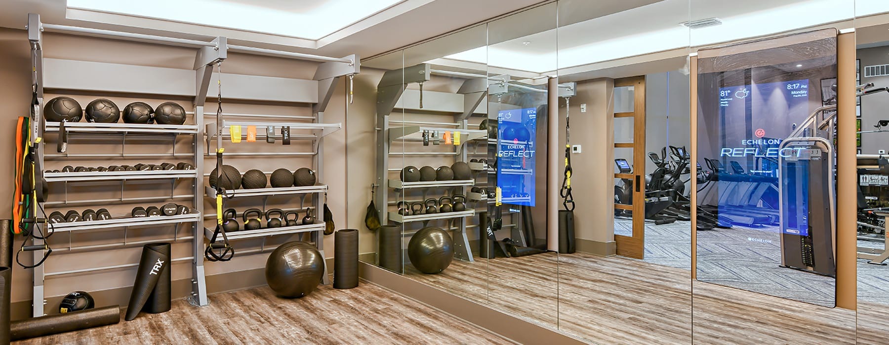 ample fitness equipment and wall-to-wall style mirrors