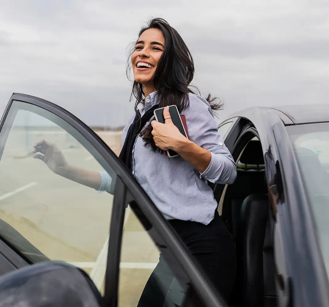 woman getting out of car