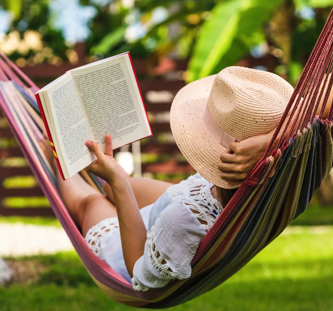 woman reading in hammock