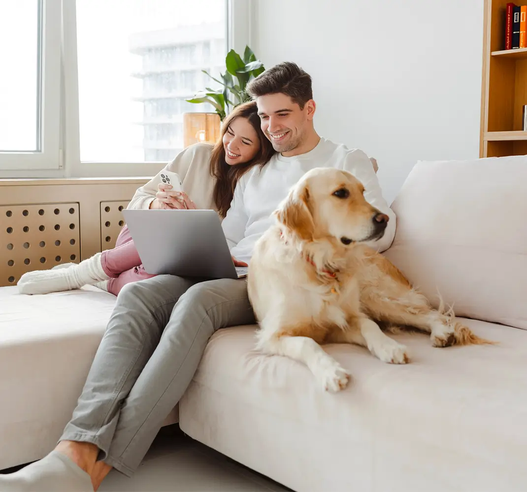 couple on the couch with dog