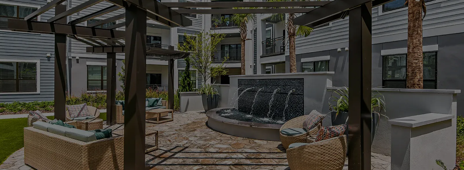 Outdoor lounge featuring a water fountain